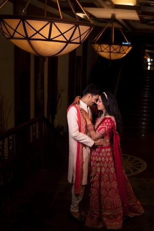 couple-red-white-dress-are-hugging-each-other